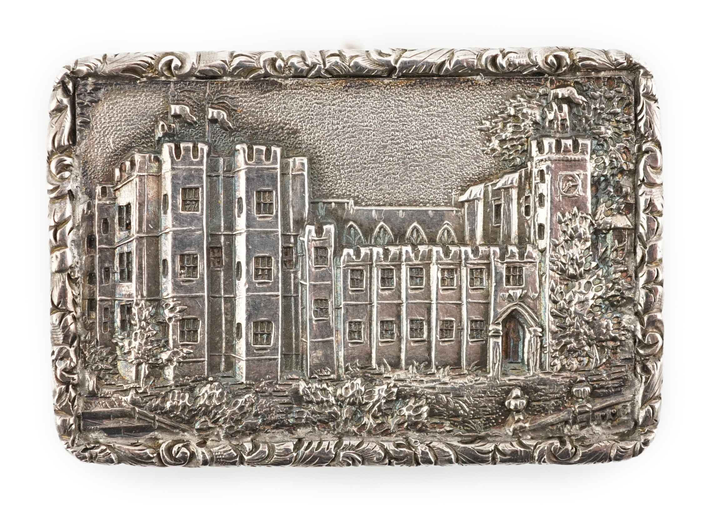 A George IV engine turned silver castle top rectangular vinaigrette, by Francis Clark, depicting ‘Kenilworth Castle’ in relief